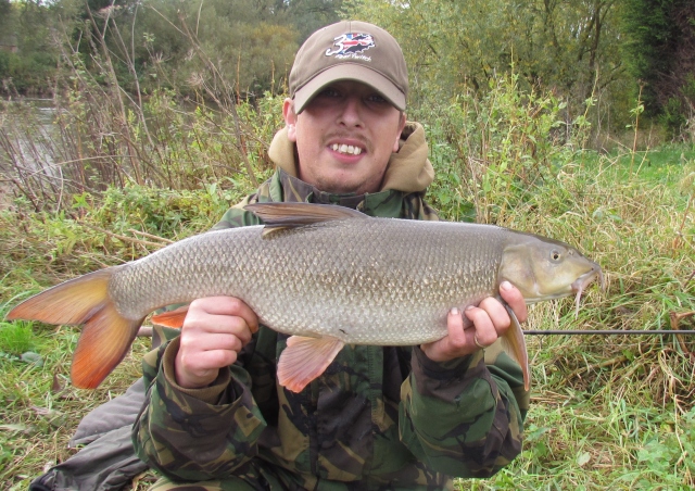 A 7lbs 10oz barbel was very  welcome in near gale conditions!
